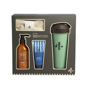 Set de Regalo Gimnasio que incluye gel de ducha, limpiador facial, toalla de algodón beige y botella verde reutilizable en un elegante empaque.